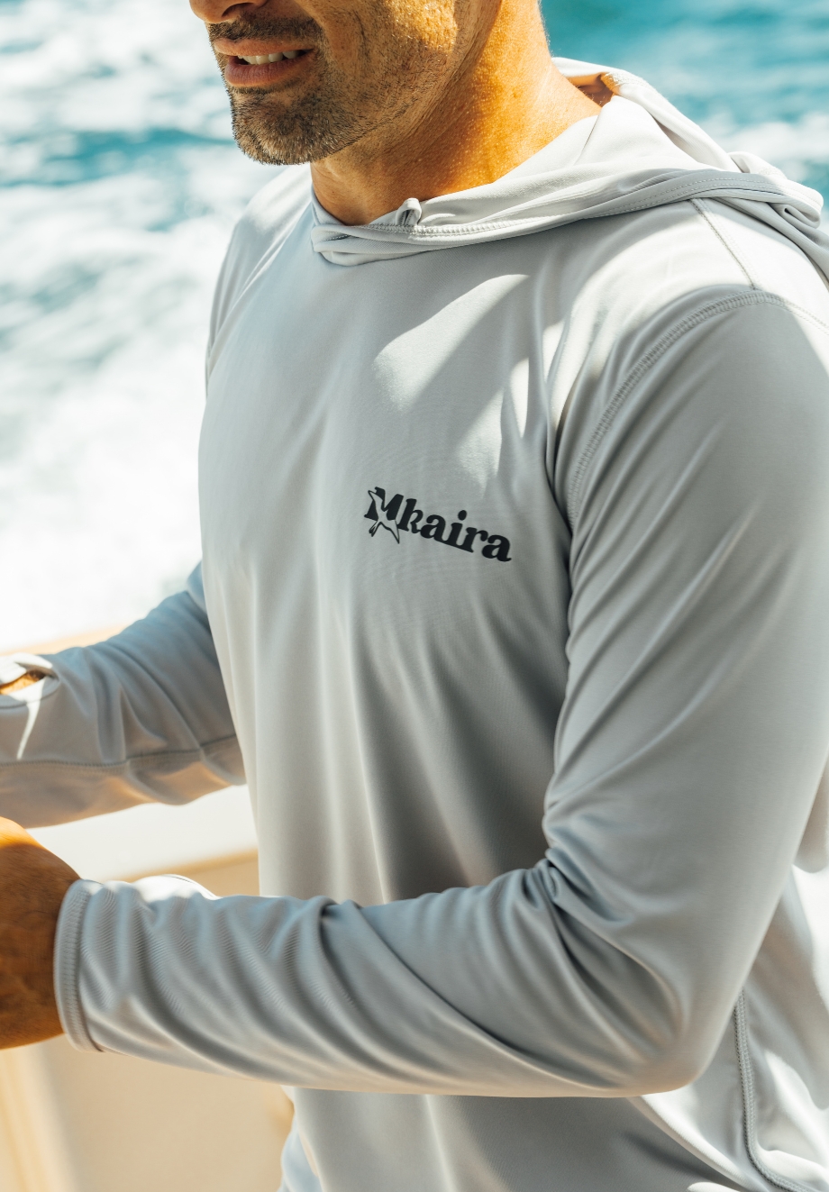 Close up of Mkaira premium custom fishing apparel hooded shirt made with performance fabric for offshore fishing.